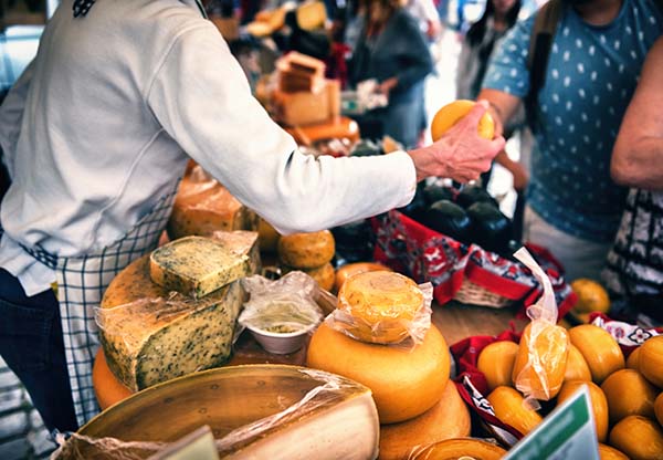 Selection of cheese at farmers traditional market.